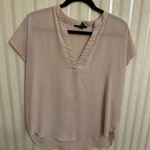 a sheer peach shirt